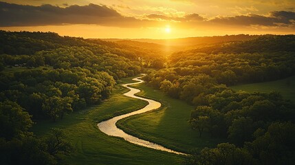 Wall Mural - Serene sunset over a meandering river in a lush green valley.