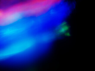 Wall Mural - a colorful, blurry background with a rainbow of colors. the colors are bright and vibrant, creating 