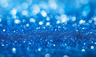 Abstract, elegant, detailed blue glitter particles flow with shallow depth of field underwater. Sparkle and light background. Holiday magic.