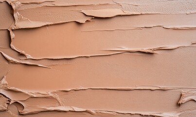 Poster - A textured surface of creamy beige paint or cosmetic product.