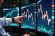 © Viktor - Businessman in office analyzes data, asset prices. Hand points at computer screen with graphs. Pro trader focused on market data on multiple monitors. Examines financial charts. Investment planning