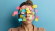 © DARIKA - An exhausted woman with colorful adhesive notes all over her face, each note symbolizing a different task or worry, representing the mental strain and exhaustion from too many obligations.