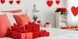 © Morninghead - A cozy bedroom decorated for a celebration, featuring red gift boxes with bows, heart-shaped wall decor, and a bouquet of roses, creating a romantic atmosphere.