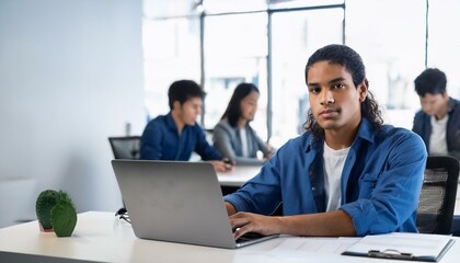 Wall Mural - A person is focused completing their work on the computer in the office; a focused office environment of a professional diligently working; teamwork and co-working; working space; hardworking