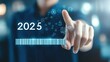© Endashii - Progress and transition from 2024 to 2025 concept. A person pointing to loading bar transitioning from 2024 to 2025, progress, future planning and new year goals. annual planning and business growth