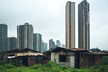 Aufkleber - Contrast of luxury skyscrapers and rundown shacks in urban landscape. Generative AI