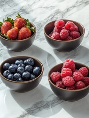 Wall Mural - Three bowls of berries on marble