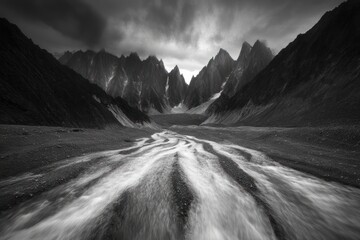 Poster - Dramatic black and white landscape photo of a mountain valley with a flowing river.