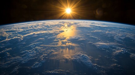 Wall Mural - Stunning sunrise over Earth, seen from space, showcasing the planet's atmosphere and clouds.