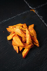 Wall Mural - baked potatoes on the black background