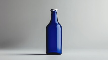 Aufkleber - A simple and modern blue beer bottle with a blank label, photographed against a grey background, offering a sleek and minimalistic look
