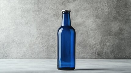 Poster - A sleek blue beer bottle with an empty label, isolated on a smooth grey background, ideal for branding, mockups, or design presentations