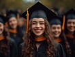 © Sergey - A group of cheerful students in graduation caps and gowns, smiling and celebrating their success on graduation day.