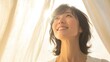 © LELISAT - Middle-aged woman smiling in a room
