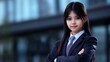 © heinng - Confident Young Woman Poses Sharply in Cityscape Photo. AI Generated