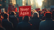 © Nadya - A crowd of people holding signs at a peaceful rally, one prominent poster reading 'Never Again' in bold red letters, blurred background of diverse faces showing unity and determination
