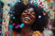 © NBLX - Portrait of young african american woman laughing, confetti in the air, happiness and celebration concept