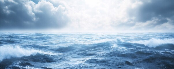 dramatic ocean waves crashing under cloudy sky
