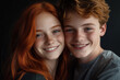 © NBLX - Portrait of joyful red hair couple teenagers freckles smiling close-up
