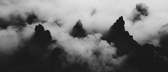 Poster - Ethereal fog envelops jagged mountain peaks creating a mystical atmosphere