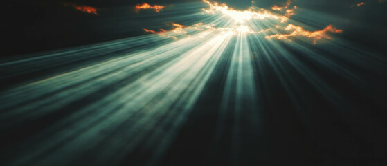 Poster - Radiant sunbeams breaking through clouds, illuminating the sky and landscape in wonder