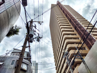 Wall Mural - Old pole with wires against the sky. Electric transmission line. Eco-friendly energy