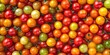 © StockKing - Vibrant small colorful tomatoes create a delightful background and texture, showcasing the unique shades and variety of small colorful tomatoes for your creative projects.