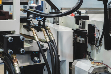 Poster - Part of industrial conveyor with hydraulic, pneumatic and electric drives, industrial concept background