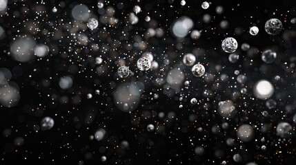 Poster - Abstract image of floating particles on a black background. The visual features a blend of light and darkness, creating an enchanting and dreamy atmosphere. Perfect for design projects.