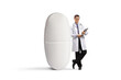 © Ljupco Smokovski - Full length portrait of a doctor with a clipboard leaning on a pill