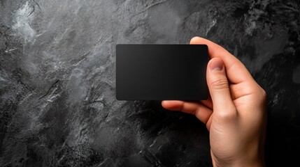 Poster - Sleek black gift card held in hand against a textured dark background with ample space for custom text and design elements. Generative AI