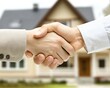 © luck - Successful Real Estate Deal: Handshake Seals the Purchase Agreement for a New Home with Keys