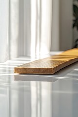 Poster - clean single bamboo plank resting on reflective white ceramic surface under soft natural lighting