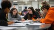 © akhmad - Diverse students collaborate on a project, studying together at a table.