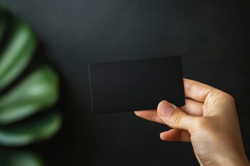 Leinwandbilder - Holding a sleek black gift card with ample space for personalized messaging and design elements. Generative AI
