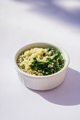 Poster - small white bowl of quinoa and greens placed on pastel lavender surface under soft natural light