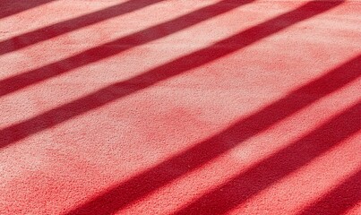 Poster - A red surface with shadows creating a striped pattern.