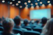 © Imagentive - Blurry Conference Attendees in Auditorium