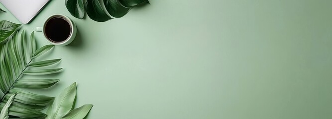 Poster - A creative flat lay of workspace desk with laptop, coffee cup, and open mockup black notebook on green background. Panoramic banner with copy space for text and advertising.