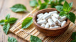 © Tameem - A bowl full of Magnesium supplements with dried herbs on a straw mat.