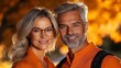 © Zaleman - Gray-haired mature smiling couple on the phone taking selfie portrait. Today's active retirees are enjoying life. Man with gray beard and woman wearing glasses.