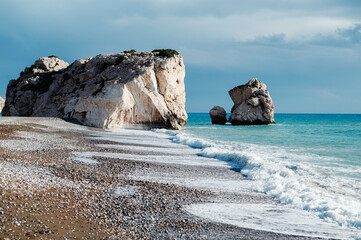 Wall Mural - Rocky Beach with Waves and Cloudy Sky