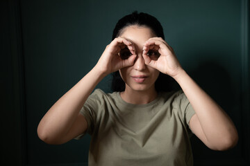 Canvas Print - woman looking through binoculars