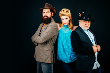 Group of fashion models posing in studio. Group of tree different ages People. Funny Friends face. Three different ages people portrait. Fun Great team. Group of three cheerful people.