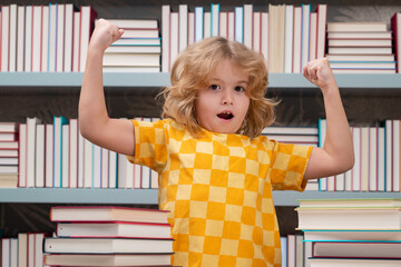 Fototapete - Back to school. Child reads books in the library. Schoolkid with book in school library. Kids literature for reading. Learning from books. School education and clever talented pupil genius.