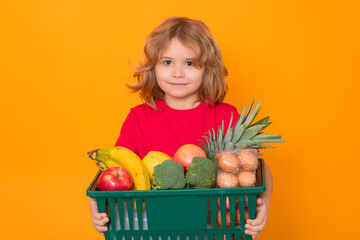 Wall Mural - Grocery shop. Shopping kids. Child buying grocery in supermarket. Grocery store, supermarket. Sale, consumerism and kids concept. Kid boy shopping using basket.