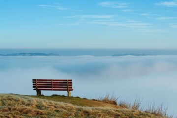 Poster - Serene view from a hillside bench overlooking fog-covered valleys and mountains during a misty morning