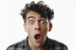 © Alexandr - Man wearing plaid shirt with mouth wide open, indicating surprise or shock.