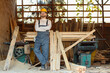 © Pixel-Shot - Male carpenter with wooden planks at sawmill