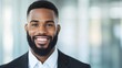 © ArtStockVault - Professional Black Bearded Businessman Smiling Confidently in Corporate Setting with Bright Expression and Modern Attire Against Soft Focus Office Background for Business and Marketing Use